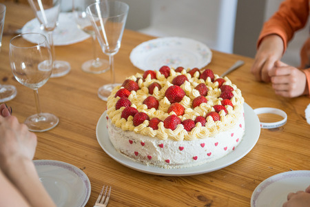 Home made strawberry cake with cream and hearts
