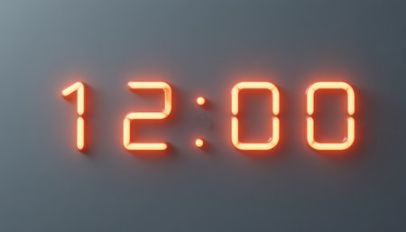 a digital clock shows twelve o'clock with orange glowing numbers on a dark gray surfaceの素材