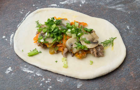 Preparing a bun with fillingの写真素材