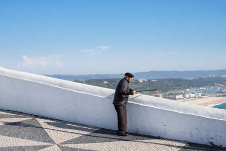 NAZARE, PORTUGAL - MAY 17, 2018.  Local enjoying the view from the Miradouro do Nazareのeditorial素材
