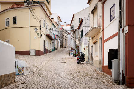 Nazare Sitio, Portugal - July 19 2019: Rua Amadeu Gaudencio, a typical rustic Portuguese streetのeditorial素材