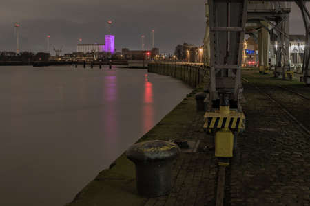 Antwerp, Belgium - February 5, 2020: View of the river Scheldt near the Waagnatie silos in the old harbor. Rijnkaai.のeditorial素材
