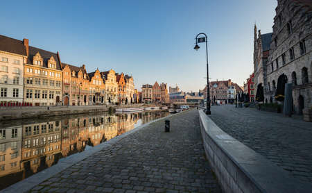 Gent, Belgium - April 9, 2020: View of the Graslei en Korenlei at sunrise, one of the most visited places in Ghent.のeditorial素材
