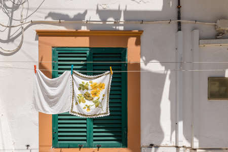 Nazare, Portugal - June 28, 2021: Typical clothesline in front of a house in Nazare Sitioのeditorial素材