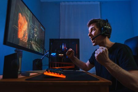 Cyber sportsman won the online video game and feels happy