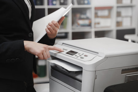 Bussinesswoman hand press button on panel of printer, printer scanner laser office copy machine...