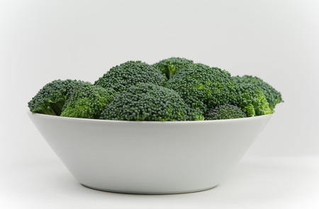 White bowl with broccoli. Focus on centerの写真素材