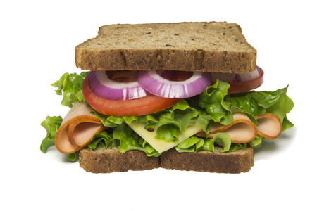 Delicious turkey sandwich  with turkey, swiss cheese, lettuce, tomato and onionsの写真素材