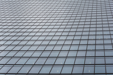 Pattern of the facade of a modern office building from steel and glassの写真素材