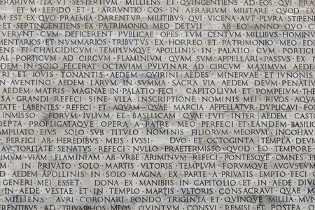 Texture of latin words engraved on a marble plaqueの写真素材