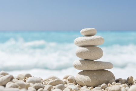 Balanced stones on a pebble beachの写真素材