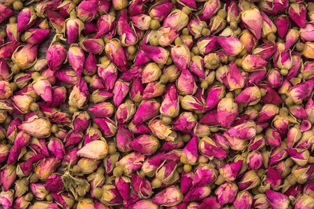 Dried rose buds background pattern close upの写真素材
