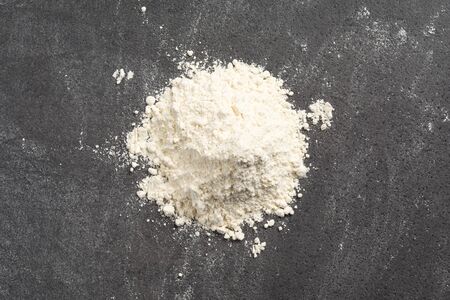 Pile of wheat flour on a messy marble kitchenの写真素材