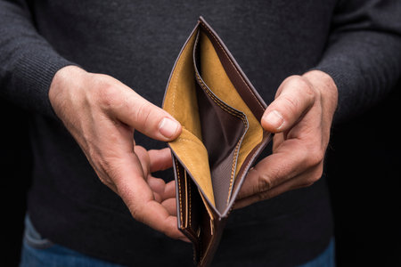 Hands holding an empty wallet, close up