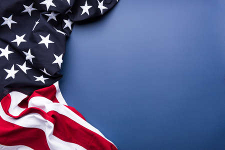 The flag of the United States of America on blue background with copy spaceの写真素材