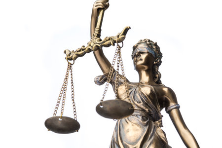 The statue of justice Themis or Justitia isolated on white backgroundの写真素材