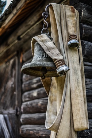 Old fire hose and the bell of the last centuryの写真素材