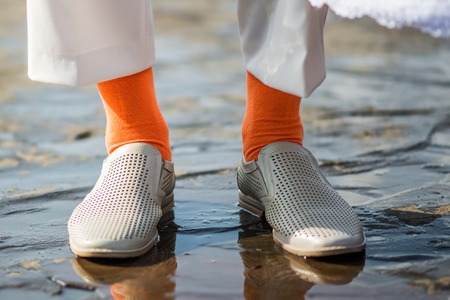 Funny orange socks as part of the groomの写真素材