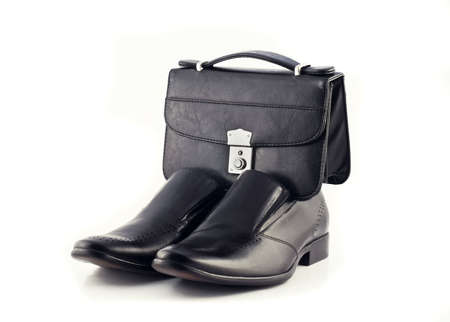 Pochette and Pair of men's classic leather shoes isolated over whiteの写真素材