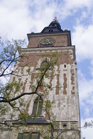 Town hall with clock in summer Krakow, Poland の写真素材