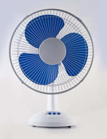 Modern desk cooling fan over white and grey backgroundの写真素材
