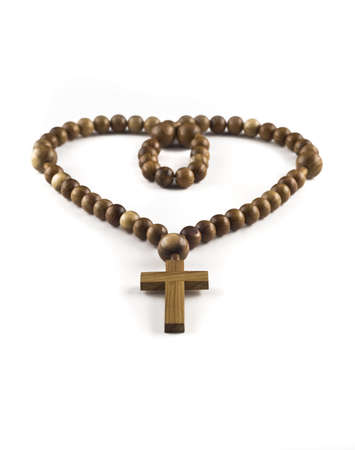 Heart figure made of Wooden beads isolated over white (shallow DOF) の写真素材