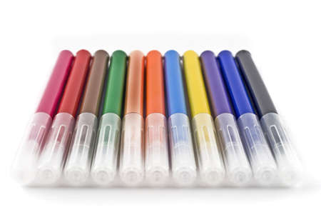 Colorful felt-tip markers (pen) over white background (shallow DOF)