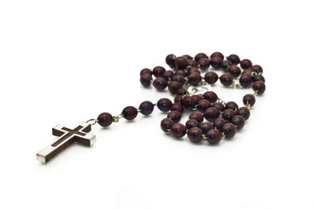 Closeup of Wooden beads isolated over white (shallow DOF). Focused on the christの写真素材