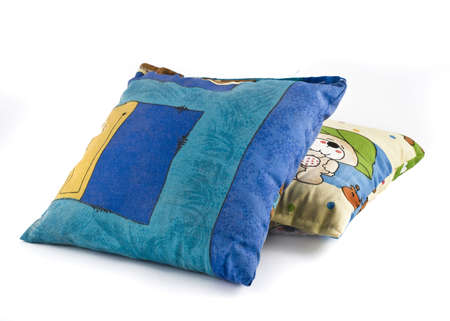 Two colorful pillows over white background の写真素材