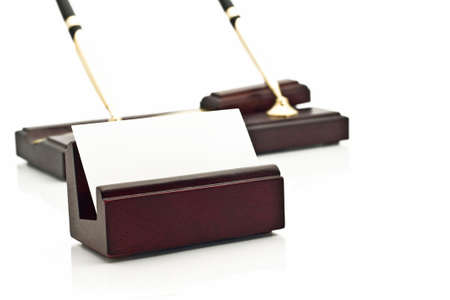 Card holder with blank white business card and two beautiful pens on stand on the background over whiteの写真素材