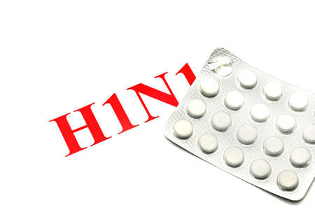 Swine FLU H1N1 - Closeup of white pills on whiteの写真素材