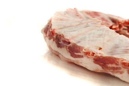 Pork ribs and meat isolated over white (shallow DOF)の写真素材