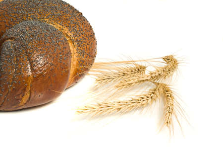 Sweet bagel with poppy seeds and wheat corn isolated over white