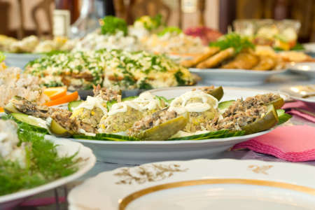 Banquet in the restaurant. Stuffed eggs and cucumbers. Focused on one dish (shallow DOF)の写真素材