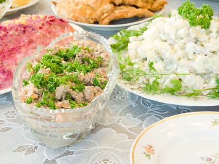 Tasty liver salad on Banquet table. Focused on one dish (shallow DOF)の写真素材