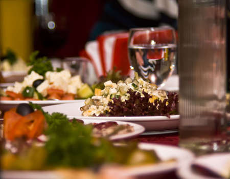 Banquet in the restaurant. Focus on one dish (shallow DOF)の写真素材