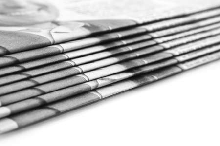 Stack of newspapers over white (Shallow DOF)の写真素材