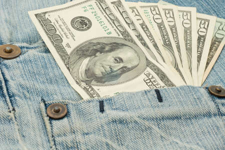 Money in jeans pocket - USA dollars banknotesの写真素材