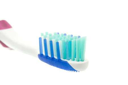 Healthy lifestyle - extreme closeup of toothbrush on whiteの写真素材
