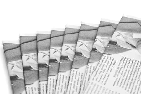 Heap of newspapers over white (Shallow DOF)