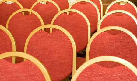 Rows of red Chairs for visitors in the conference hall の写真素材