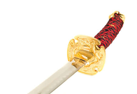Closeup of golden katana sword isolated on whiteの写真素材