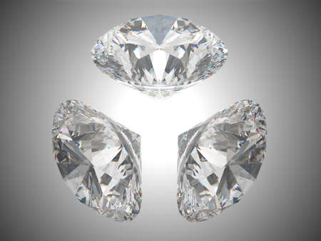 Three brilliant cut diamonds or gems. Over grey backgroundの写真素材