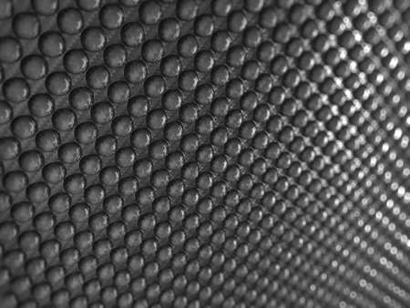 Pimply Carbon fibre with shallow DOF. Useful as abstract backgroundの写真素材