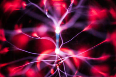 Plasma light beams in the darkness. Useful as abstract patternの写真素材