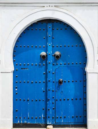 Blue gate and door with ornament from Sidi Bou Said in Tunisiaの写真素材