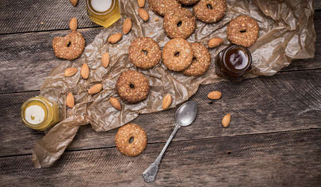 Nuts and Cookies with sesame on wooden table. Rustic style and autumn food photoの写真素材
