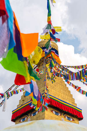 Boudhanath Stupa and prayer flags in Kathmandu, Nepal. Buddhist stupa of Boudha Stupa is one of the...