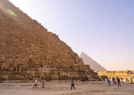 People taking photos and selfies near Pyramids of Giza in Cairo. Captured in Egypt. Autumn 2018のeditorial素材