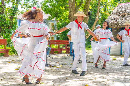 Dancers in costumes and musicians perform traditional cuban folk dance. Cuba, spring 2018